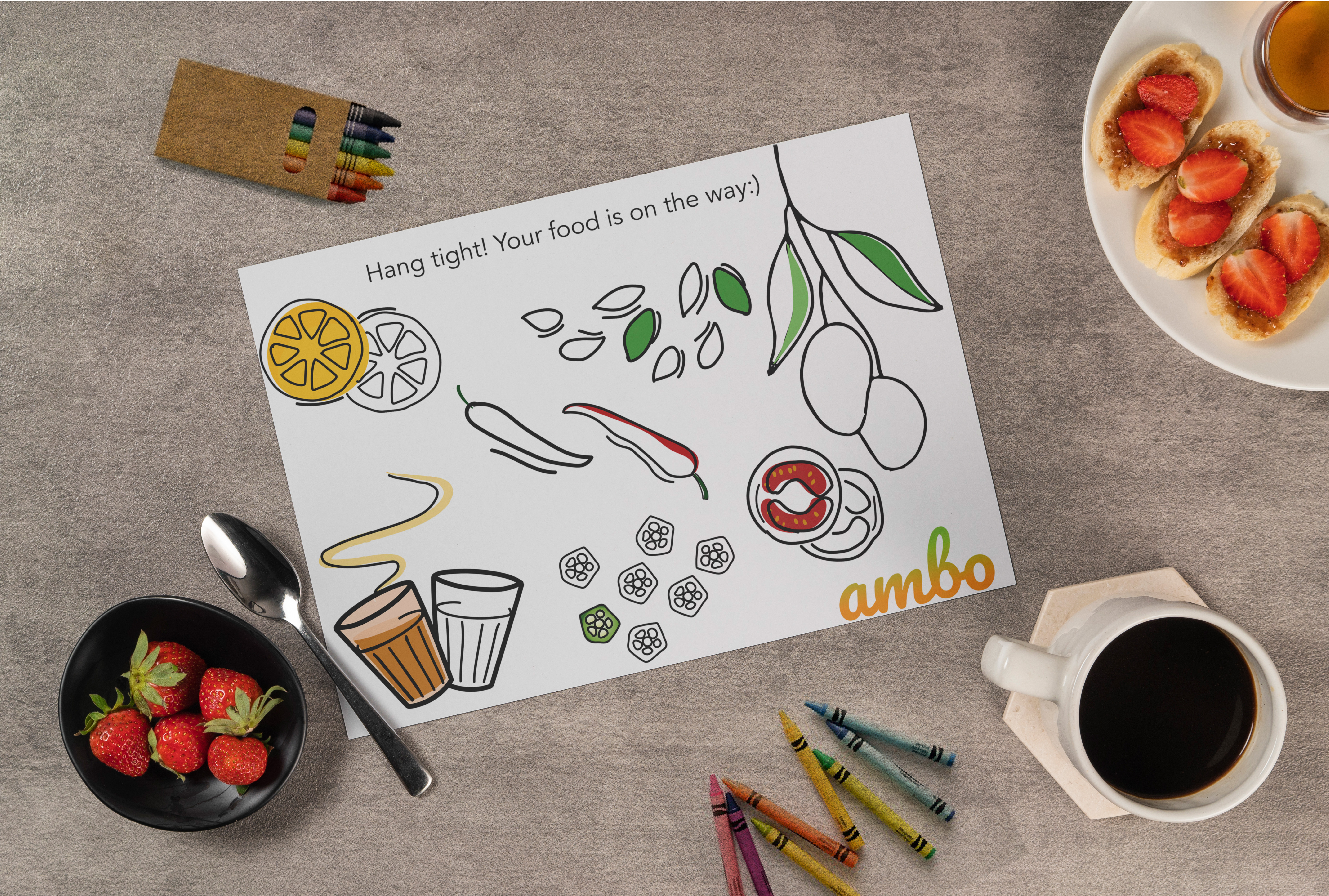 Ambo colouring table mat on a cafe table with crayons and coffee