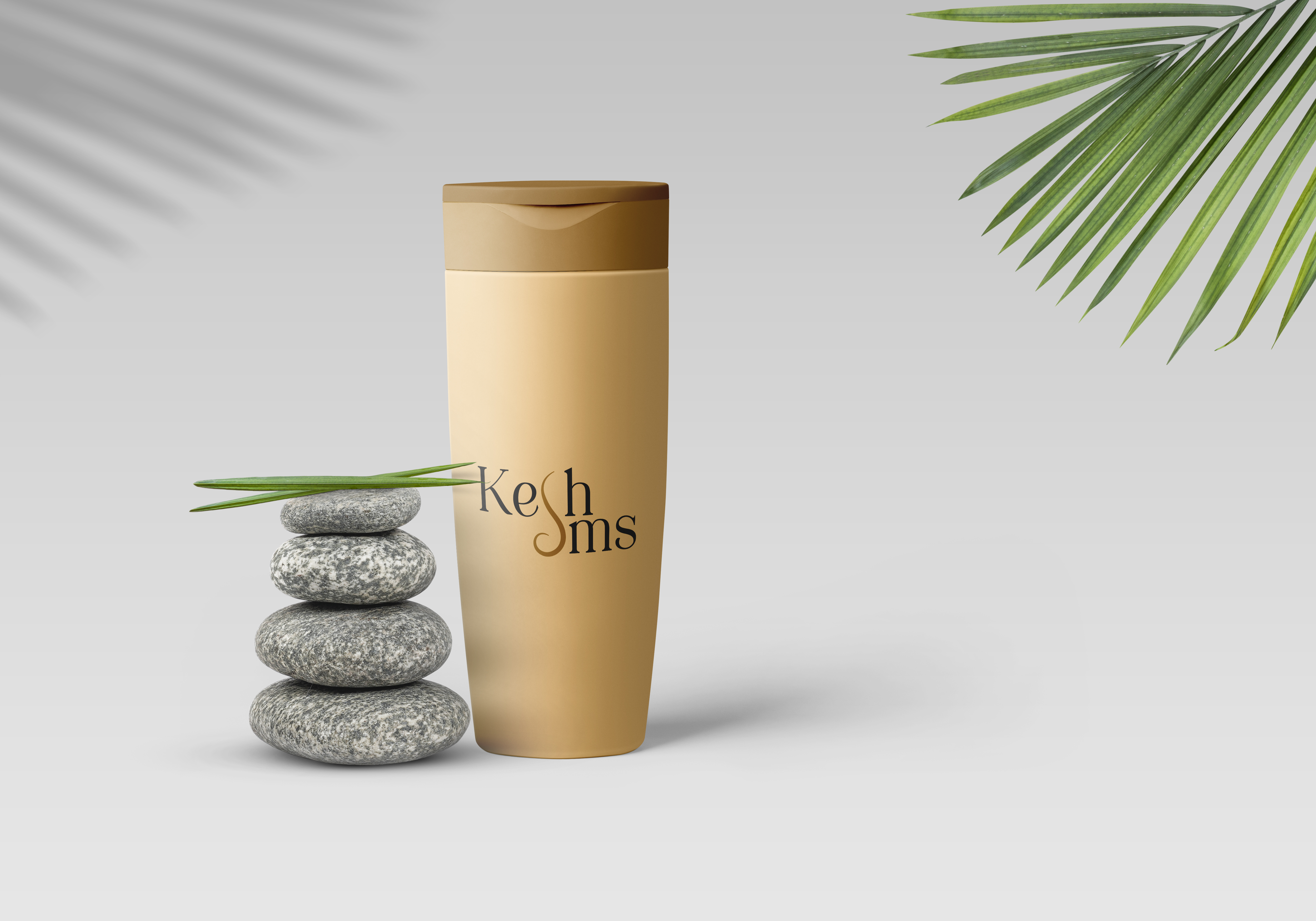 Kesh SMS shampoo bottle with stones and palm leaf